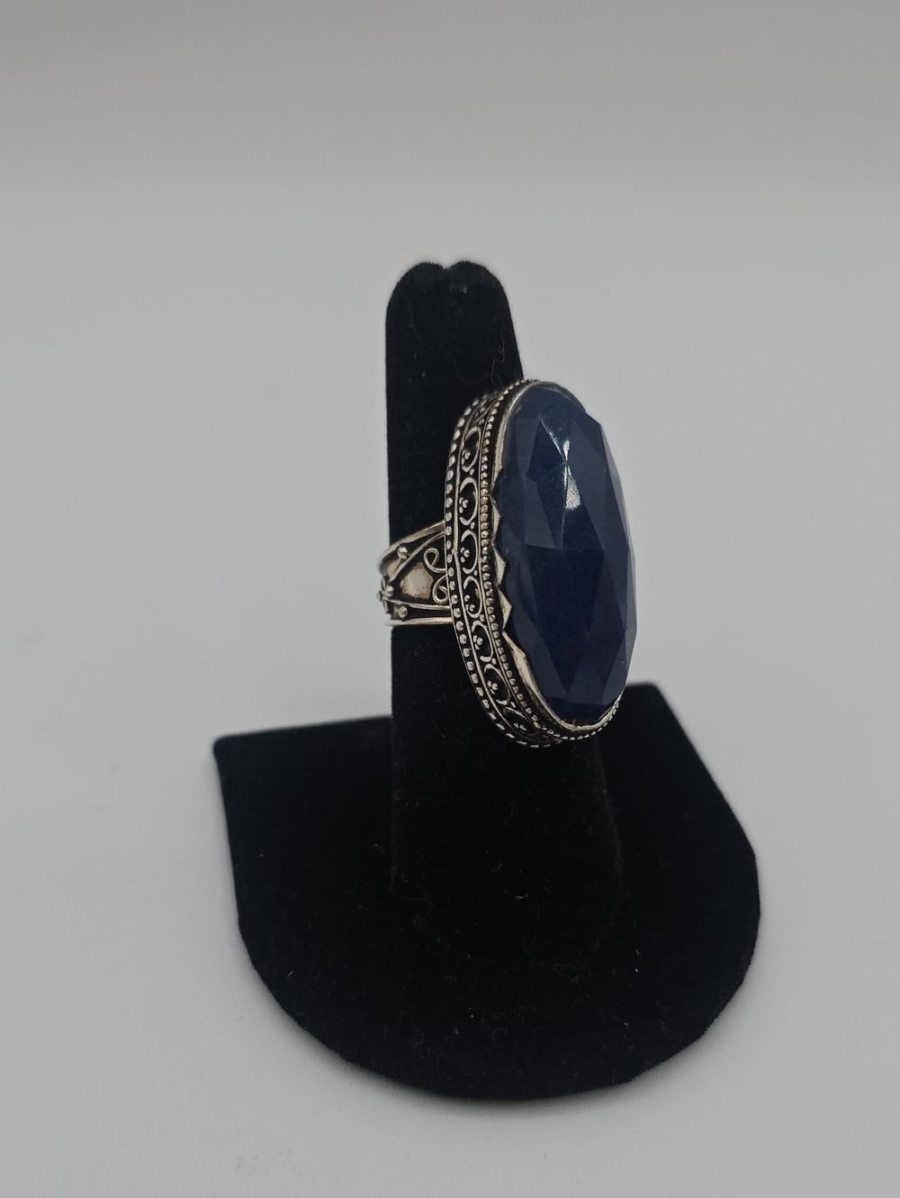 Sterling Silver Filigree Ring with Deep Blue Faceted Gemstone